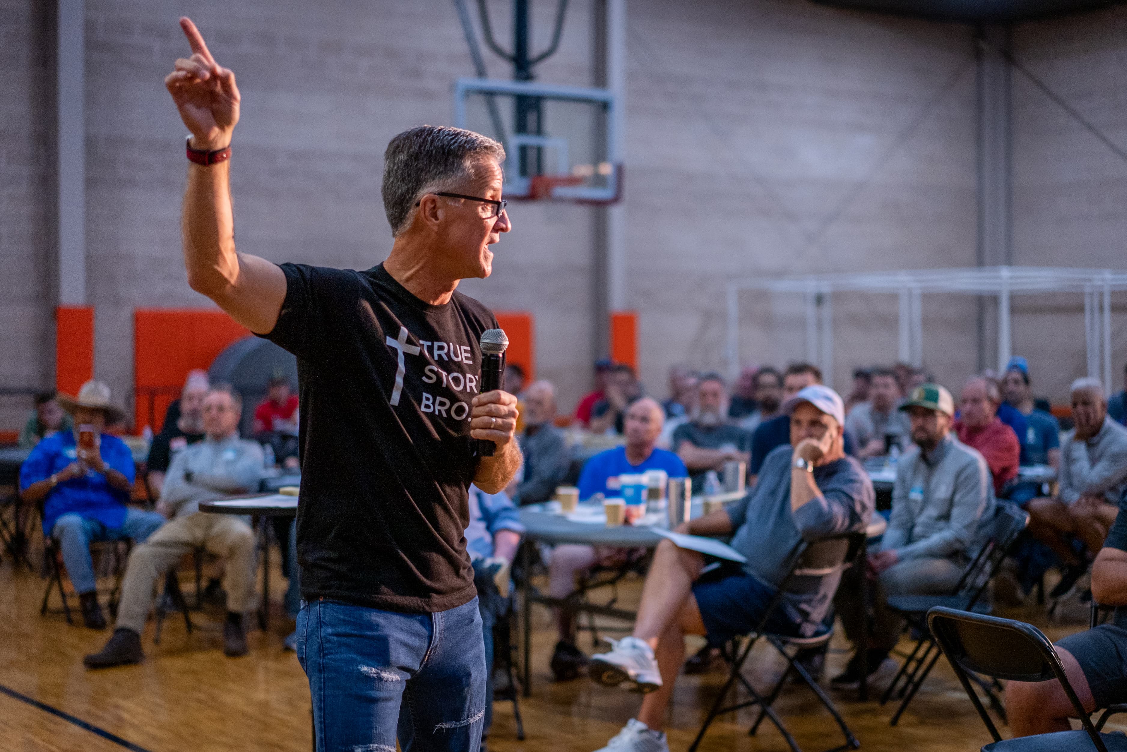 Pastor Chuck preaching to men at a RealMen Ministries gathering